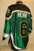 Dryden Henry #6 Green 1999-2000.  Worn during the 99-00 season by Dryden Henry. Shoulder patches, NOB & USHL chest crest. Great looking "Dazzel" material. Made by K1 it is a size XL.