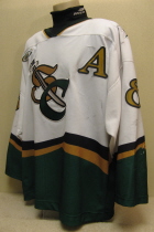 Jeff Van Dyke #8 White 2000-01.  This was worn by, Musketeer fan favorite, Jeff Van Dyke during the 2000-01 season. Jeff played in SC 3 seasons before being traded to the Lincoln Stars. Sholder patches, USHL chest crest and alternate's "A". It is manufactured by OT Sports and is sized XXL.