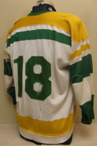 Bogdan Podwysocki #18 1974-75/75-76   These are the second style jersey worn by the Musketeers for 2 seasons. This one was worn by fan favorite Bubba Podwysocki. Originally, these had the traditional circular Tri-State crest. Upon arrival of new Musketeer jerseys for the 76-77 season, these were handed down to the Sioux City High School team, where the front crest was removed and replaced by the generic "Sioux City" logo. Both sets were altered so finding one of these originals w/crest is gonna be a toughie!!!