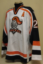 Omaha Lancers Trevor Smith 04-05 #23 This white gamer was worn by Trevor Smith. Trevor lead the Lancers in scoring this season. Lancer old logo patches on shoulder, USHL and CCM Tagging on rear hem, NOB. Aternate captain "A". Shows nice overall wear. Made by CCM, size 56.
