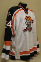 Omaha Lancers Ted Cook 04-05 This white gamer was worn by Trevor Smith. Lancer old logo patches on shoulder, USHL and CCM Tagging on rear hem, NOB. Shows nice wear. Made by CCM, size 56. 