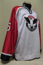 Waterloo BlackHawks #16 2001-02 White  This one was worn during the 2001-02 season by Zac Headrick. Has tons of wear as it was used for this and the previous season. Manufactured by SP, it is size 56. 