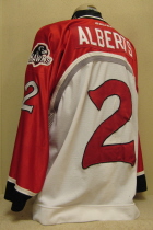 Waterloo Black Hawks White #2 Andrew Alberts. This one was worn for two season by Andrew Alberts 99-00 and 00-01. It is made by Bauer and is a size 56. It also has the 'Hawks alternate shoulder logo and the Bauer and USHL chest crests.