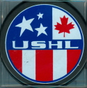 Reverse USHL game puck Late 1996-2000. This (thin ring) is the reverse that was most common on most USHL game and souvenir pucks during mid-late 90's seasons. The Thunder Bay Flyers, Canada's USHL representative, final season was 99-00. The USHL logo was changed after that season removing the Maple leaf and being replaced buy eight stars, each representing one of the original USHL teams.