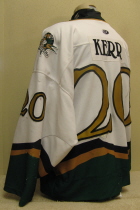 Brian Kerr #20 White 2000-01  Worn one season, 00-01 by Brian Kerr. This jersey is made by OT Sports. Great wear, altered length by host mom, shoulder patches, NOB and USHL crest.