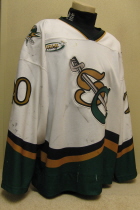 Brian Kerr #20 White 2000-01  Worn one season, 00-01 by Brian Kerr. This jersey is made by OT Sports. Great wear, altered length by host mom, shoulder patches, NOB and USHL crest.