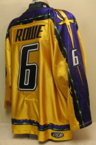 Andrew Rowe  #6 Yellow 06-07.  This  jersey was worn during the 2006-07 season by Andrew Rowe. Manufactured by OT Sports, this size 54 shows nice wear. This was the first season for the yellow jerseys.  The Musketeers also wore a special purple jersey for part of the season and a dark green for the road jerseys.