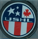 Reverse USHL game puck Late 1996-2000. This is the reverse (thickringe) that was most common on most USHL game and souvenir pucks during mid-late 90's seasons. The Thunder Bay Flyers, Canada's USHL representative, final season was 99-00. The USHL logo was changed after that season removing the Maple leaf and being replaced buy eight stars, each representing one of the original USHL teams.